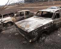 Charred ruins, crime scenes dot Australian bush