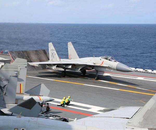 Taiwan says 'troublemaker' China expands military drills around island