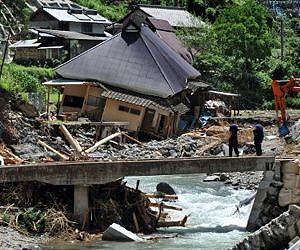 Dozens flee Japan mudslide island to beat new typhoon