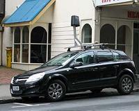 Google revs up driverless car, axes steering wheel
