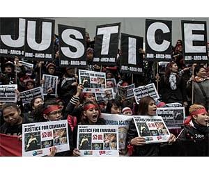 Thousands of Hong Kong domestic helpers rally for 'tortured' maid