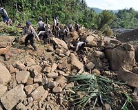 Dozens trapped as Indonesia quake toll rises to 57