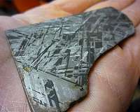 Iron-rich meteorites show record of core crystallization in system's oldest planetesimals