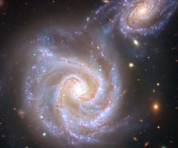 Milky Way collision path mirrored in distant galaxy pair