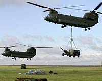 Canada weighs arms options, buys Chinooks