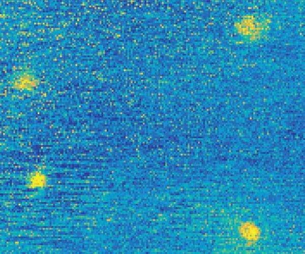 Cooling with light explored through semiconductor quantum dots