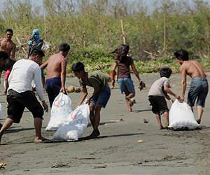 Philippines buries some dead as survivors beg for help