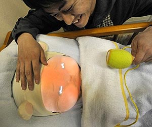 Japanese baby-bot with runny nose teaches parenting skills
