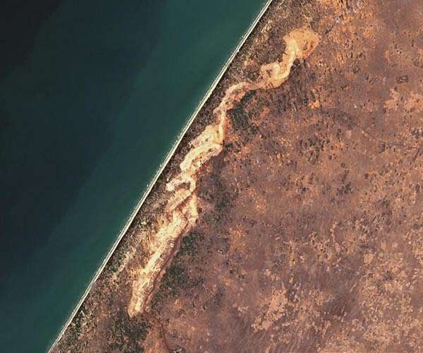 Giant mine machine swallowing up Senegal's fertile coast