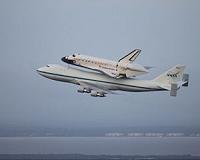 Shuttle replica lifted and put on top of 747 carrier