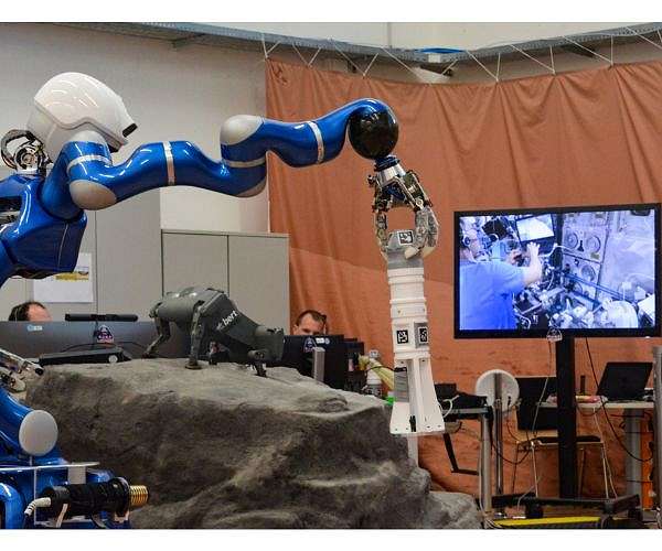 Surface Avatar - an astronaut on board the ISS controls a robot team on Earth