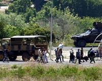 Turkey calls for help with Syria refugees as tensions rise
